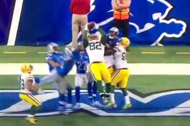Packers stun Lions with Hail Mary TD