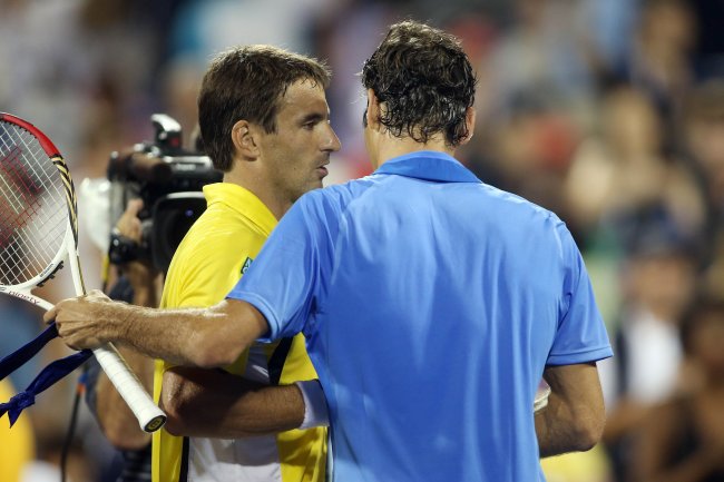 Robredo saluda Federer - US Open '13