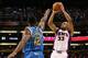 PHOENIX - NOVEMBER 11: Grant Hill #33 of the Phoenix Suns puts up a shot over Hilton Armstrong #12 of the New Orleans Hornets during the NBA game at US Airways Center on November 11, 2009 in Phoenix, Arizona. NOTE TO USER: User expressly acknowledges and