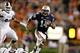 Sep 14, 2013; Auburn, AL, USA; Auburn Tigers quarterback Nick Marshall (14) avoids Mississippi State Bulldog defenders during the fourth quarter at Jordan Hare Stadium. The Tigers beat the Bulldogs 24-20. Mandatory Credit: John Reed-USA TODAY Sports