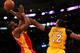 LOS ANGELES, CA - APRIL 17: James Harden #13 of the Houston Rockets shoots over Dwight Howard #12 of the Los Angeles Lakers at Staples Center on April 17, 2013 in Los Angeles, California. The Lakers won 99-95 in overtime. NOTE TO USER: User expressly a