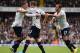 LONDON, ENGLAND - SEPTEMBER 14: Gylfi Sigurosson of Spurs (C) is congratulated by Kyle Walker and Andros Townsend (R) of Spurs on scoring their first goal during the Barclays Premier League match between Tottenham Hotspur and Norwich City at White Hart
