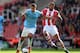 STOKE ON TRENT, ENGLAND - SEPTEMBER 14: Jack Rodwell of Manchester City is tackled by Steven Nzonzi of Stoke City during the Barclays Premier League match between Stoke City and Manchester City at Britannia Stadium on September 14, 2013 in Stoke on Trent
