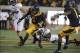Aug 31, 2013; Berkeley, CA, USA; California Golden Bears running back Brendan Bigelow (5) escapes the tackle by Northwestern Wildcats cornerback Daniel Jones (15) during the first quarter at Memorial Stadium. Mandatory Credit: Kelley L Cox-USA TODAY Sport