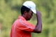 ATLANTA, GA - SEPTEMBER 19: Tiger Woods walks off the 18th hole following the first round of the TOUR Championship by Coca-Cola at East Lake Golf Club on September 19, 2013 in Atlanta, Georgia. (Photo by Sam Greenwood/Getty Images)
