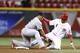 CINCINNATI, OH - SEPTEMBER 4: Billy Hamilton #6 of the Cincinnati Reds steals second base ahead of the throw to Kolten Wong #16 of the St. Louis Cardinals in the 14th inning of the game at Great American Ball Park on September 4, 2013 in Cincinnati, Ohio.