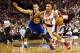 April 17, 2013; Portland, OR, USA; Portland Trail Blazers point guard Damian Lillard (0) dribbles past Golden State Warriors point guard Stephen Curry (30) in the first half at the Rose Garden. Mandatory Credit: Jaime Valdez-USA TODAY Sports