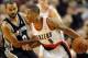 Dec 13, 2012; Portland, OR, USA; Portland Trail Blazers point guard Damian Lillard (0) dribbles the ball past San Antonio Spurs point guard Tony Parker (9) during the fourth quarter of the game at the Rose Garden. Lillard scored 29 points as the Blazers w