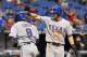 ST. PETERSBURG, FL - SEPTEMBER 19: Geovany Soto #8 of the Texas Rangers is congratulated on his eighth-inning home run by Craig Gentry #23 against the Tampa Bay Rays September 19, 2013 at Tropicana Field in St. Petersburg, Florida. Texas won 8 - 2. (Pho