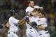 CLEVELAND, OH - SEPTEMBER 19: Teammates Michael Bourn #24 Jason Kipnis #22 and Mike Aviles #4 celebrate with Matt Carson #7 of the Cleveland Indians after Carson hit a walk-off RBI single during the eleventh inning to defeat the Houston Astros at Progress