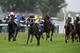 YARMOUTH, ENGLAND - SEPTEMBER 19: Pat Cosgrave riding Wednaan (2L) wins The British Stallion Studs EBF Sprint Maiden Stakes at Yarmouth racecourse on September 19, 2013 in Yarmouth, England. (Photo by Alan Crowhurst/Getty Images)