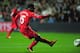 SWANSEA, WALES - SEPTEMBER 16: Liverpool striker Daniel Sturridge scores the first Liverpool goal during the Barclays Premier League match between Swansea City and Liverpool at Liberty Stadium on September 16, 2013 in Swansea, Wales. (Photo by Stu Forste
