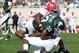 Sep 14, 2013; East Lansing, MI, USA; Michigan State Spartans running back Jeremy Langford (33) is stopped short of the goal line by Youngstown State Penguins safety Tre' Moore (30) during the second half in a game at Spartan Stadium. MSU won 55-17. Mandat