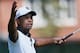 ATLANTA, GA - SEPTEMBER 20: Tiger Woods reacts on the third green after making his first birdie of the tournament during the second round of the TOUR Championship by Coca-Cola at East Lake Golf Club on September 20, 2013 in Atlanta, Georgia. (Photo by K