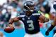 CHARLOTTE, NC - SEPTEMBER 08: Russell Wilson #3 of the Seattle Seahawks against the Carolina Panthers during their game at Bank of America Stadium on September 8, 2013 in Charlotte, North Carolina. (Photo by Streeter Lecka/Getty Images)