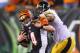 CINCINNATI, OH - SEPTEMBER 16: Andy Dalton #14 of the Cincinnati Bengals runs with the ball dwhile defended by LaMarr Woodley #56 of the Pittsburgh Steelers during the game at Paul Brown Stadium on September 16, 2013 in Cincinnati, Ohio. (Photo by Andy