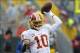 Sep 15, 2013; Green Bay, WI, USA; Washington Redskins quarterback Robert Griffin III (10) warms up prior to the game against the Green Bay Packers at Lambeau Field. Mandatory Credit: Benny Sieu-USA TODAY Sports