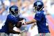 EAST RUTHERFORD, NJ - SEPTEMBER 15: Eli Manning #10 of the New York Giants hands the ball off to David Wilson #22 during the first quarter against the Denver Broncos at MetLife Stadium on September 15, 2013 in East Rutherford, New Jersey. (Photo by Madd