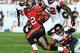 TAMPA, FL - NOVEMBER 25: Running back Doug Martin #22 of the Tampa Bay Buccaneers rushes upfield against the Atlanta Falcons November 25, 2012 at Raymond James Stadium in Tampa, Florida. The Falcons won 24 - 23. (Photo by Al Messerschmidt/Getty Images)