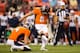 DENVER, CO - AUGUST 24: Place kicker Matt Prater #5 of the Denver Broncos kicks a field goal on a hold by Britton Colquitt #4 against the St. Louis Rams at Sports Authority Field at Mile High on August 24, 2013 in Denver, Colorado. (Photo by Justin Edmond
