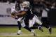 OAKLAND, CA - DECEMBER 06: Eric Decker #87 of the Denver Broncos gets tackled by Joselio Hanson #23 of the Oakland Raiders after a short reception in the fourth quarter at Oakland-Alameda County Coliseum on December 6, 2012 in Oakland, California. The Br