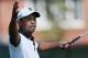 ATLANTA, GA - SEPTEMBER 20: Tiger Woods reacts on the third green after making his first birdie of the tournament during the second round of the TOUR Championship by Coca-Cola at East Lake Golf Club on September 20, 2013 in Atlanta, Georgia. (Photo by K