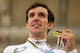 MINSK, BELARUS - FEBRUARY 22: Simon Yates of Great Britain poses with his medal winning the Men's Points Race on day three of the 2013 UCI Track World Championships at the Minsk Arena on February 22, 2013 in Minsk, Belarus. (Photo by Bryn Lennon/Getty I
