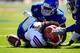LAWRENCE, KS - SEPTEMBER 21: Defensive lineman Keon Stowers #98 and cornerback Dexter McDonald #12 of the Kansas Jayhawks compete against wide receiver Richie Casey #1 of the Louisiana Tech Bulldogs for a loose ball during the end of the 4th quarter of t