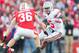 Nov 17, 2012; Madison, WI, USA; Ohio State Buckeyes quarterback Braxton Miller (5) rushes with the football as Wisconsin Badgers linebacker Ethan Armstrong (36) defends during the second quarter at Camp Randall Stadium. Mandatory Credit: Jeff Hanisch-US