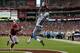 GLENDALE, AZ - SEPTEMBER 15: Wide receiver Calvin Johnson #81 of the Detroit Lions catches a touchdown pass in front of cornerback Patrick Peterson #21 of the Arizona Cardinals in the first half at University of Phoenix Stadium on September 15, 2013 in G