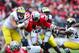 Nov 24, 2012; Columbus, OH, USA; Ohio State Buckeyes quarterback Braxton Miller (5) runs for a first down in the third quarter against the Michigan Wolverines at Ohio Stadium. Mandatory Credit: Andrew Weber-USA TODAY Sports