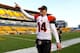PITTSBURGH, PA - DECEMBER 23: Andy Dalton #14 of the Cincinnati Bengals celebrates while walking off of the field following their 13-10 win over the Pittsburgh Steelers during the game at Heinz Field on December 23, 2012 in Pittsburgh, Pennsylvania. (Phot