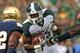 SOUTH BEND, IN - SEPTEMBER 21: Jeremy Langford #33 of the Michigan State Spartans runs against the Notre Dame Fighting Irish at Notre Dame Stadium on September 21, 2013 in South Bend, Indiana.(Photo by Jonathan Daniel/Getty Images)