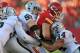 KANSAS CITY, MO - OCTOBER 28: Defenders Miles Burris #56, Mike Mitchell #34 and Rolando McClain #55 of the Oakland Raiders tackle running back Peyton Hillis #40 of the Kansas City Chiefs during the second quarter on October 28, 2012 at Arrowhead Stadium