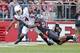 Sep 21, 2013; Piscataway, NJ, USA; Arkansas Razorbacks wide receiver Keon Hatcher (4) catches pass as he is defended by Rutgers Scarlet Knights defensive back Lew Toler (24) during the first half at High Points Solutions Stadium. Mandatory Credit: Jim O'