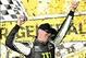 Sep 14, 2013; Joliet, IL, USA; NASCAR Nationwide Series driver Kyle Busch (54) celebrates in victory lane after winning the Dollar General 300 at Chicagoland Speedway. Mandatory Credit: Rob Grabowski-USA TODAY Sports