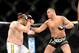 Dec 15, 2012; Las Vegas, NV, USA; Roy Nelson (left) is punched by Matt Mitrione (right) during their heavyweight bout in the Ultimate Fighter Finale at The Joint at the Hard Rock Hotel and Casino. Nelson won by KO. Mandatory Credit: Josh Holmberg-USA TODA