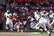 MADISON, WI - SEPTEMBER 21: James White #20 of the Wisconsin Badgers runs away from the defense against the Purdue Boilermakers during the game at Camp Randall Stadium on September 21, 2013 in Madison, Wisconsin. (Photo by Joe Robbins/Getty Images)