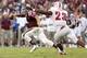 HOUSTON, TX- SEPTEMBER 21: Johnny Manziel #2 of the Texas A&M Aggies avoids the tackle of Stephon Sanders #23 of the Southern Methodist Mustangs in the first half on September 21, 2013 at Kyle Field in College Station, Texas. (Photo by Thomas B. Shea/Gett