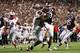 HOUSTON, TX- SEPTEMBER 21: Mike Evans #13 of the Texas A&M Aggies is tackled by Darrian Wright #54 of the Southern Methodist Mustangs in the first half on September 21, 2013 at Kyle Field in College Station, Texas. (Photo by Thomas B. Shea/Getty Images)