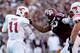 HOUSTON, TX- SEPTEMBER 21:Ryan Lindblade #63 of the Texas A&M Aggies holds Garrett Gilbert #11 of the Southern Methodist Mustangs face mask in the first half on September 21, 2013 at Kyle Field in College Station, Texas. (Photo by Thomas B. Shea/Getty Ima
