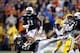 Sep 21, 2013; Baton Rouge, LA, USA; Auburn Tigers running back Tre Mason (21) is tripped up as he carries the ball in front of LSU Tigers safety Corey Thompson (12) in the second quarter against the Auburn Tigers at Tiger Stadium. Mandatory Credit: Crysta
