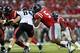 Sep 7, 2013; Oxford, MS, USA; Mississippi Rebels defensive end Robert Nkemdiche (5) and Southeast Missouri State Redhawks wide receiver Art Mueller (84) fight for the line during the first half at Vaught-Hemingway Stadium. Mandatory Credit: Spruce Derden-