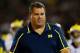 EAST HARTFORD, CT - SEPTEMBER 21: Brady Hoke, coach of the Michigan Wolverines walks the sideline in the second half against the Connecticut Huskies at Rentschler Field on September 21, 2013 in East Hartford, Connecticut. (Photo by Jim Rogash/Getty Imag