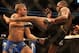 Sep 21, 2013; Toronto, Ontario, CAN; Jon Jones connects on a kick against Alexander Gustafsson (left) during their Light Heavyweight Championship bout at UFC 165 at the Air Canada Centre. Mandatory Credit: Tom Szczerbowski-USA TODAY Sports