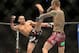 Sep 21, 2013; Toronto, Ontario, CAN; Renan Barao (left) throws a kick at Eddie Wineland during their interim bantamweight championship bout at UFC 165 at the Air Canada Centre. Mandatory Credit: Tom Szczerbowski-USA TODAY Sports