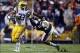 Sep 21, 2013; Baton Rouge, LA, USA; LSU Tigers running back Jeremy Hill (33) fights off Auburn Tigers linebacker Kris Frost (17) as he carries the ball in the second quarter at Tiger Stadium. Frost was called for a personal foul on the play. Mandatory Cre