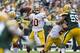 GREEN BAY, WI - SEPTEMBER 15: Robert Griffin III #10 of the Washington Redskins throws a pass against the Green Bay Packers at Lambeau Field on September 15, 2013 in Green Bay, Wisconsin. The Packers defeated the Redskins 38-20. (Photo by Wesley Hitt/Gett