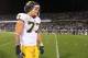 EAST HARTFORD, CT - SEPTEMBER 21: Taylor Lewan #77 of the Michigan Wolverines leaves the field after defeating the Connecticut Huskies at Rentschler Field on September 21, 2013 in East Hartford, Connecticut. (Photo by Jim Rogash/Getty Images)