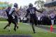 Sep 21, 2013; Evanston, IL, USA; Northwestern Wildcats linebacker Damien Proby (46) returns an interception for a touchdown past Maine Black Bears quarterback Marcus Wasilewski (7) during the second quarter at Ryan Field. Mandatory Credit: Jerry Lai-USA